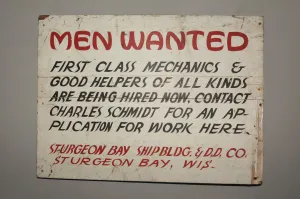 Picture of old sign with stylised font starting with MEN WANTED - J Theodore, https://unsplash.com/photos/5UeasJVXLjA